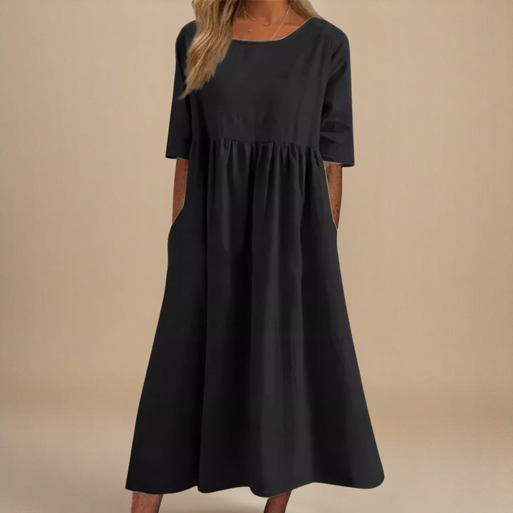 Comfortable women's relaxed fit midi dress. Versatile half-sleeve style, ideal for casual summer fashion.
