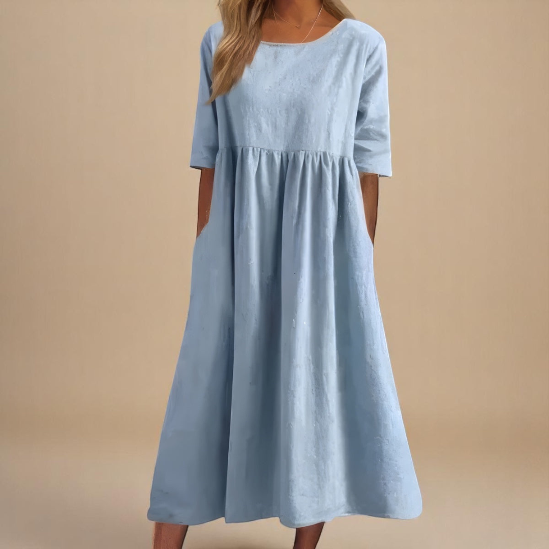 Stylish women's summer midi dress with half sleeves. Empire waist design creates an elegant & comfortable look.