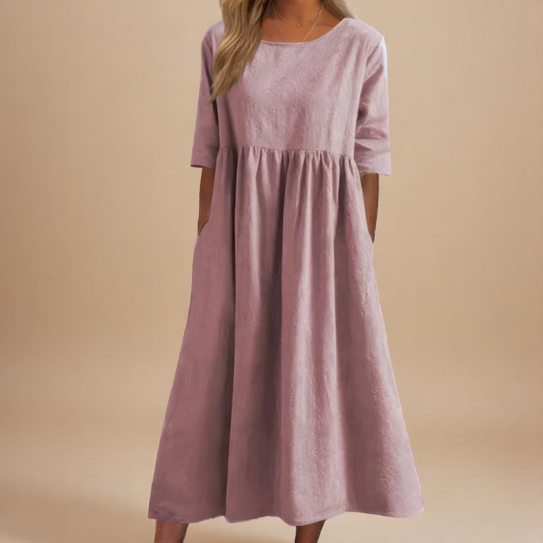 Women's flowy pocket midi dress with half sleeves. Comfortable and casual, ideal for a chic summer outfit.