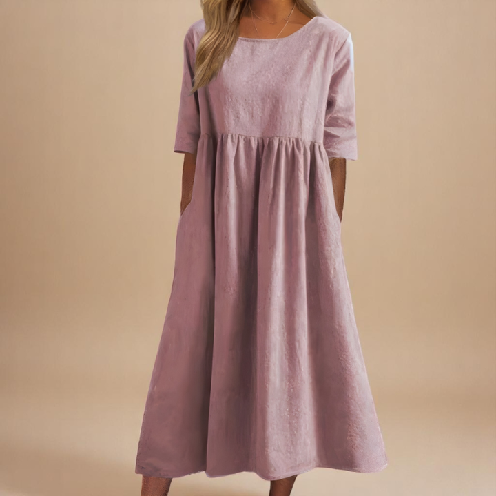 Women's flowy pocket midi dress with half sleeves. Comfortable and casual, ideal for a chic summer outfit.