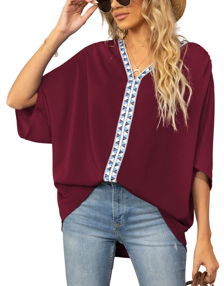 Boho-style women's V-neck tunic with elegant geometric trim, relaxed fit for everyday wear.