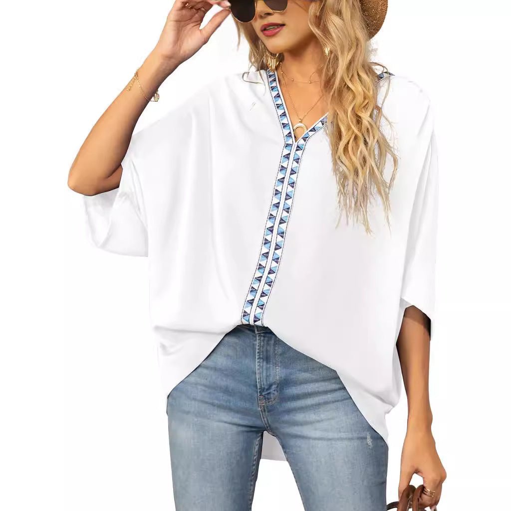 Spring fashion women's tunic top, V-neck, bold geometric trim, relaxed and breezy style.