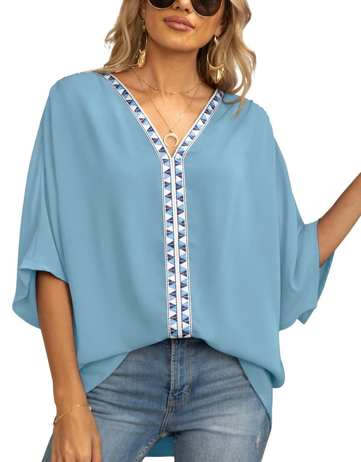 Casual women's blouse: V-neck tunic with chic geometric trim, perfect for a boho summer look.