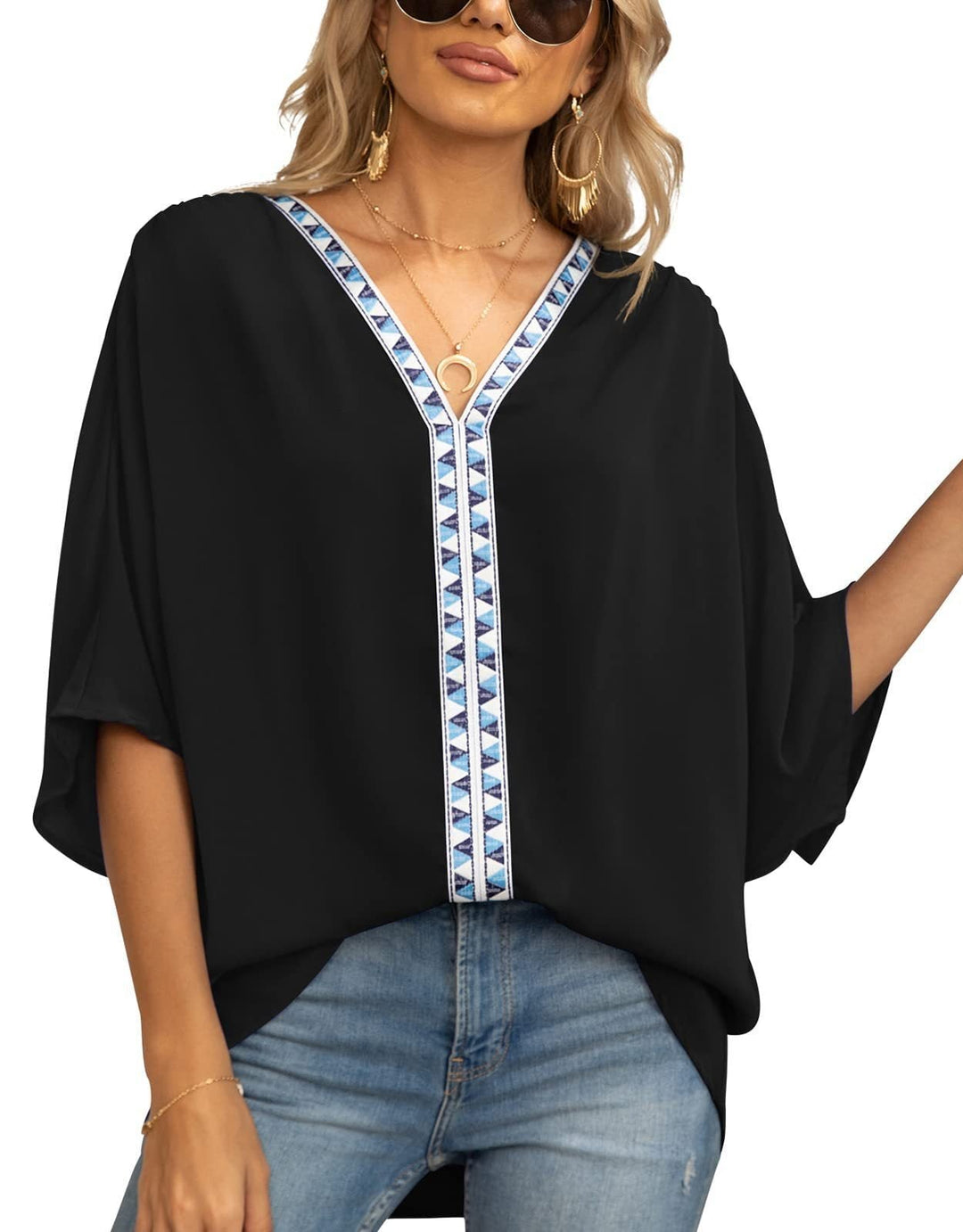 Women's V-neck tunic top with sophisticated geometric trim, offering a relaxed and stylish fit.