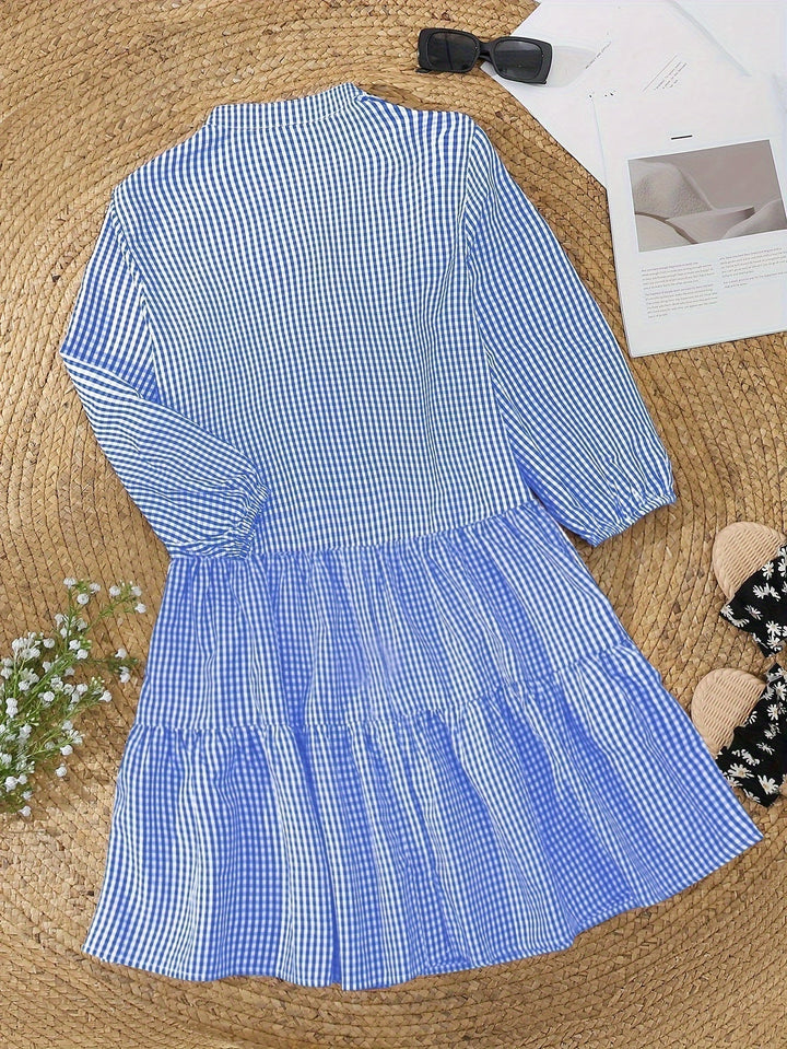 Gingham check print mini dress for women with a playful ruffle hem. A stylish and comfortable summer tiered dress.
