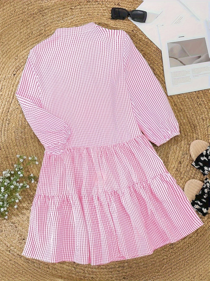 Casual women's gingham mini dress with button front & puff sleeves. Tiered design for a classic, feminine summer look.
