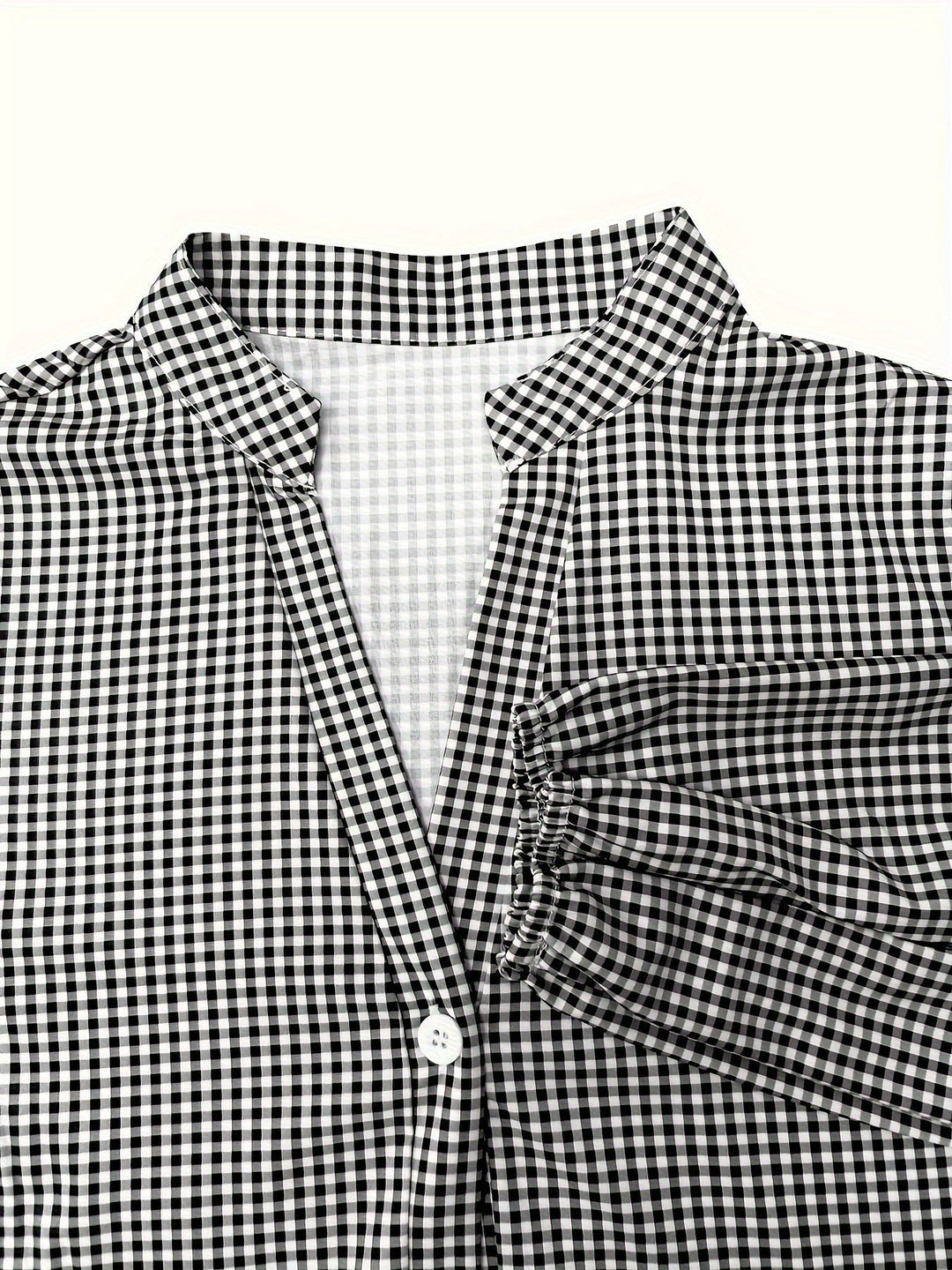 Stylish women's tiered mini dress in gingham check. Features trendy puff sleeves and a flattering summer fit.