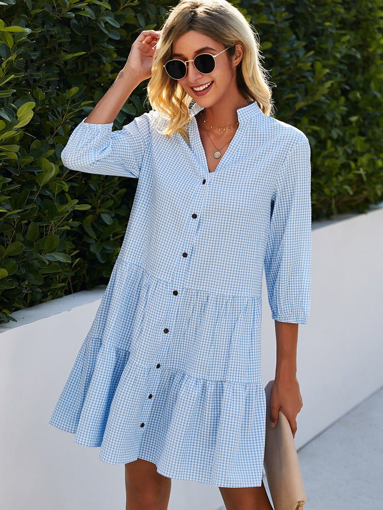 Women's gingham tiered mini dress with button-down front and ruffle hem, perfect for summer.