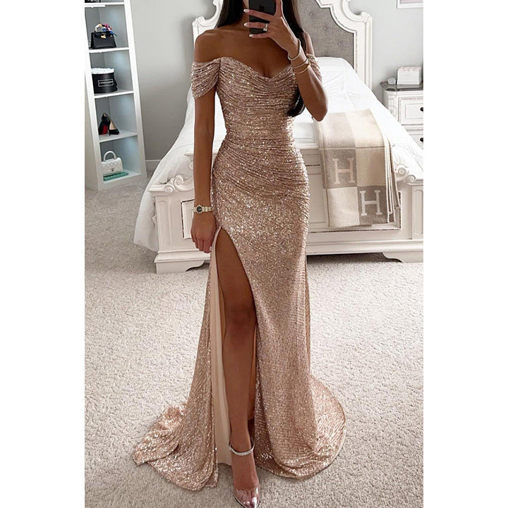 Model showcasing women's sequin off-shoulder party dress. Glamorous high slit, bodycon maxi, perfect for evenings.