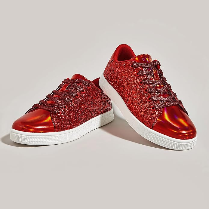 Close-up of shimmery glitter texture on women's lace-up fashion sneakers. Sparkle shoes detail.