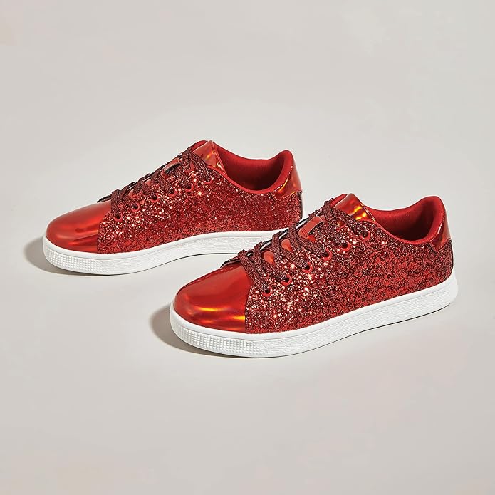 Side view of women's trendy glitter fashion sneakers with lace-up detail. Athletic style casual footwear.