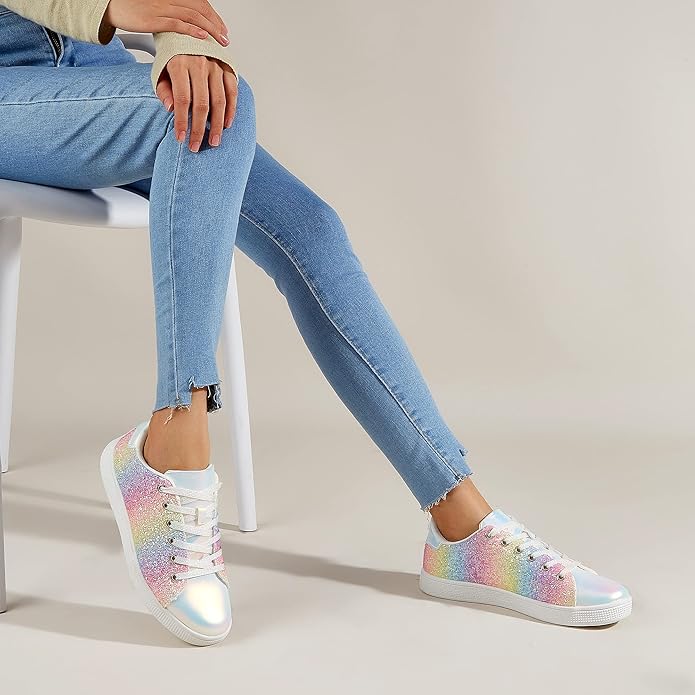 Front view of women's sparkle lace-up sneakers, highlighting trendy design and glitter finish.