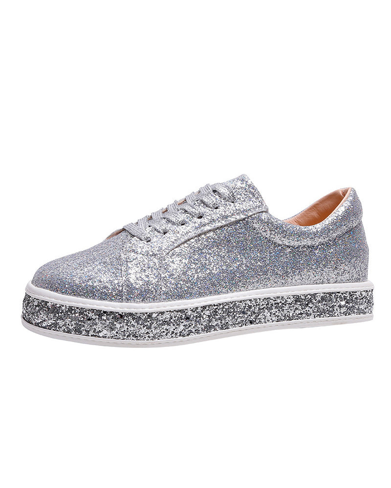 Close-up of women's glitter platform sneakers, showcasing the sparkly texture and stylish design for fashion.