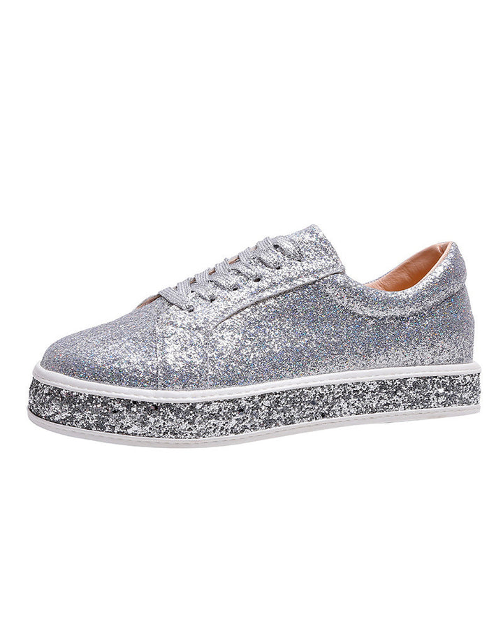 Close-up of women's glitter platform sneakers, showcasing the sparkly texture and stylish design for fashion.