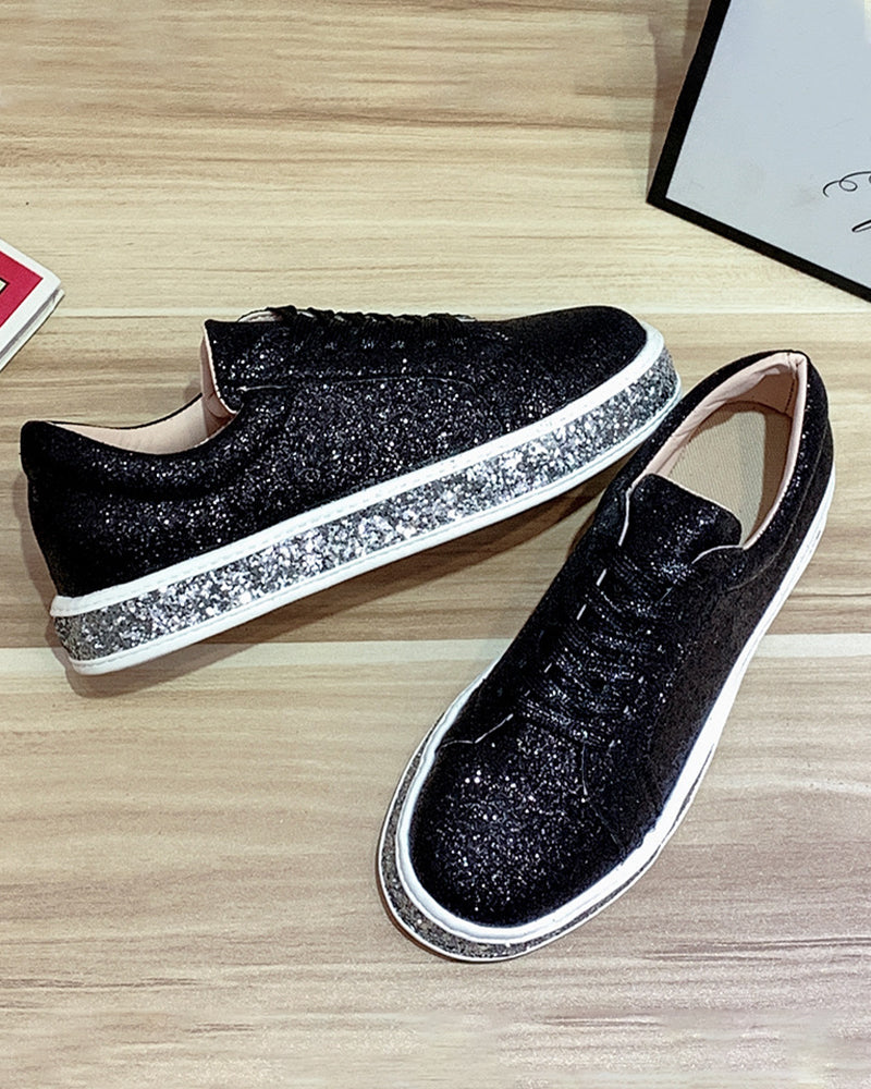 Chic sparkly women's platform sneakers. Trendy fashion footwear with glitter details for a stylish look.