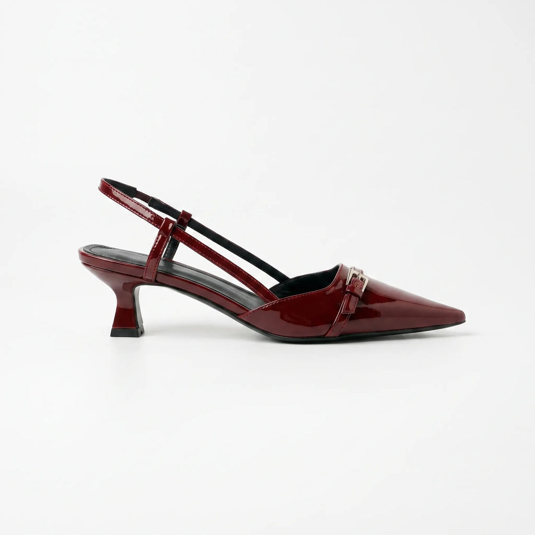 Chic women's glossy patent leather pointed toe slingback heels. Stylish and versatile for formal events.