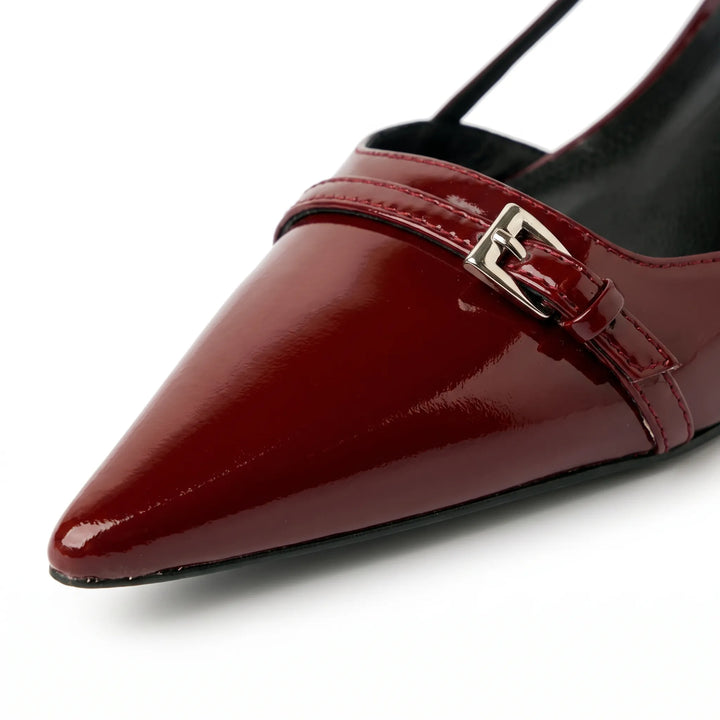 Sleek black glossy women's pointed toe heels with a secure slingback strap. Ideal for work, parties, and evenings.