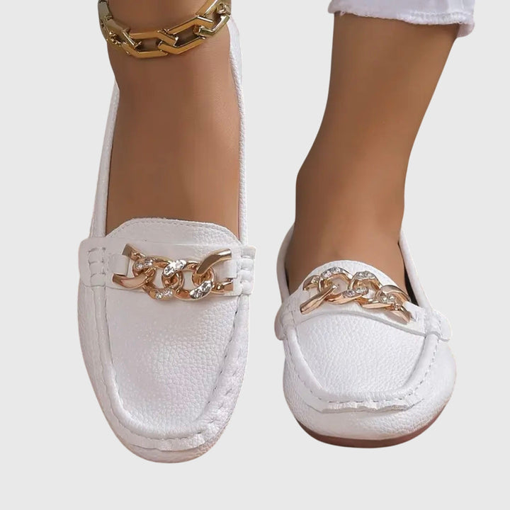 Premium women's wedge loafers with gold chain and crystal accents, ideal for elegant footwear.