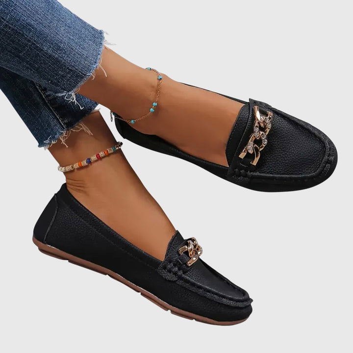 Comfortable women's wedge loafers, perfect for dress or casual wear, adorned with gold chain & crystal.