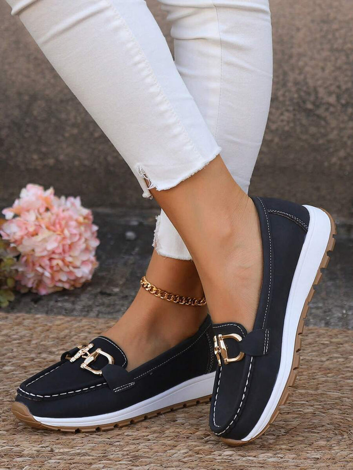 Women's gold-trim horsebit loafers; elegant slip-on comfort for classic everyday and office wear.