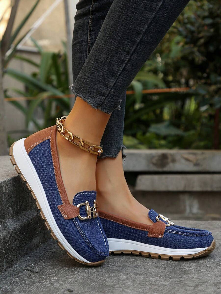 Stylish & comfortable women's slip-on loafers with elegant gold horsebit detail. Perfect for any outfit.