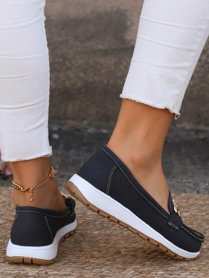 Brown women's gold-trim horsebit loafers. Elegant classic slip-on footwear, perfect for everyday comfort.