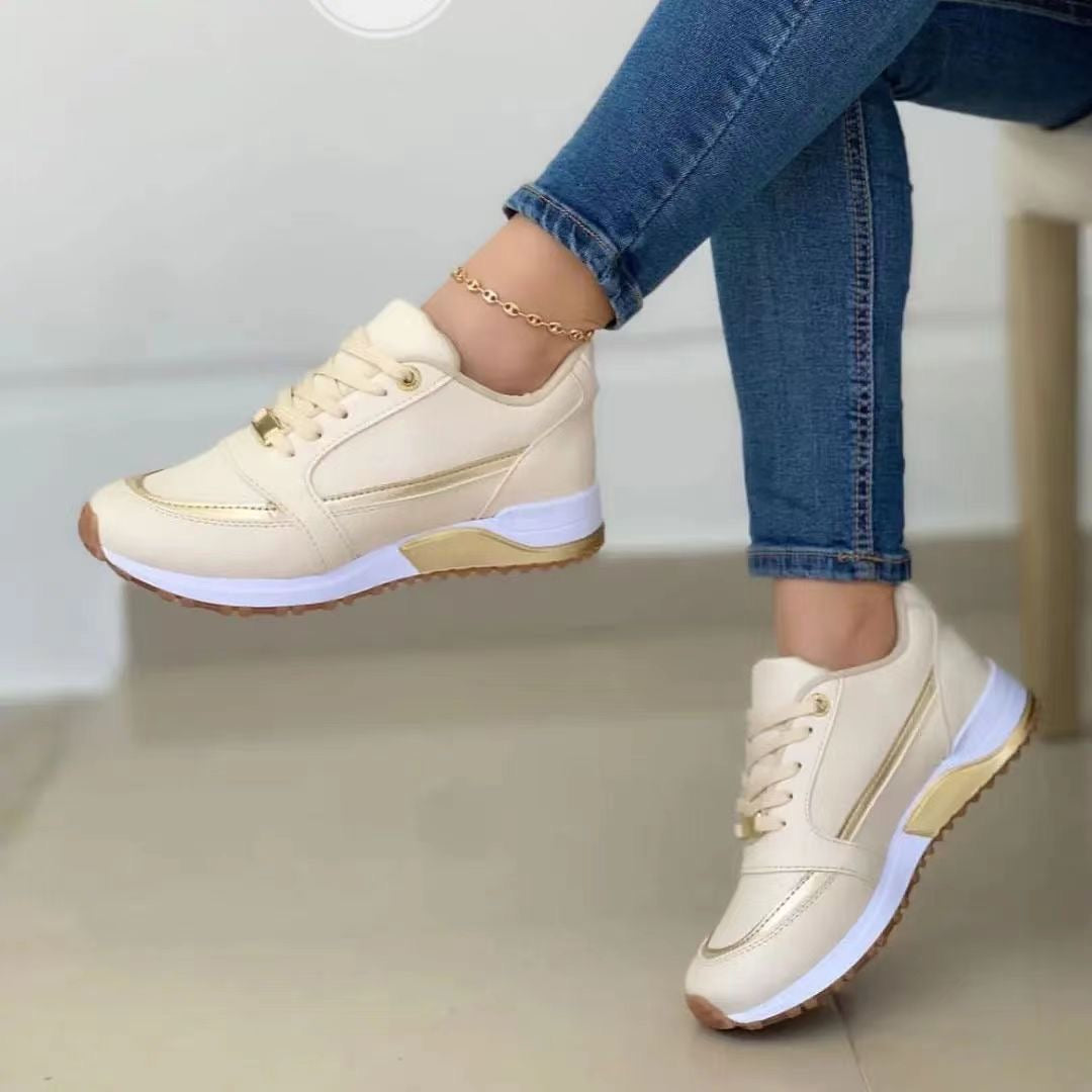 Women's gold trim lace-up platform sneakers, perfect for stylish everyday casual wear.