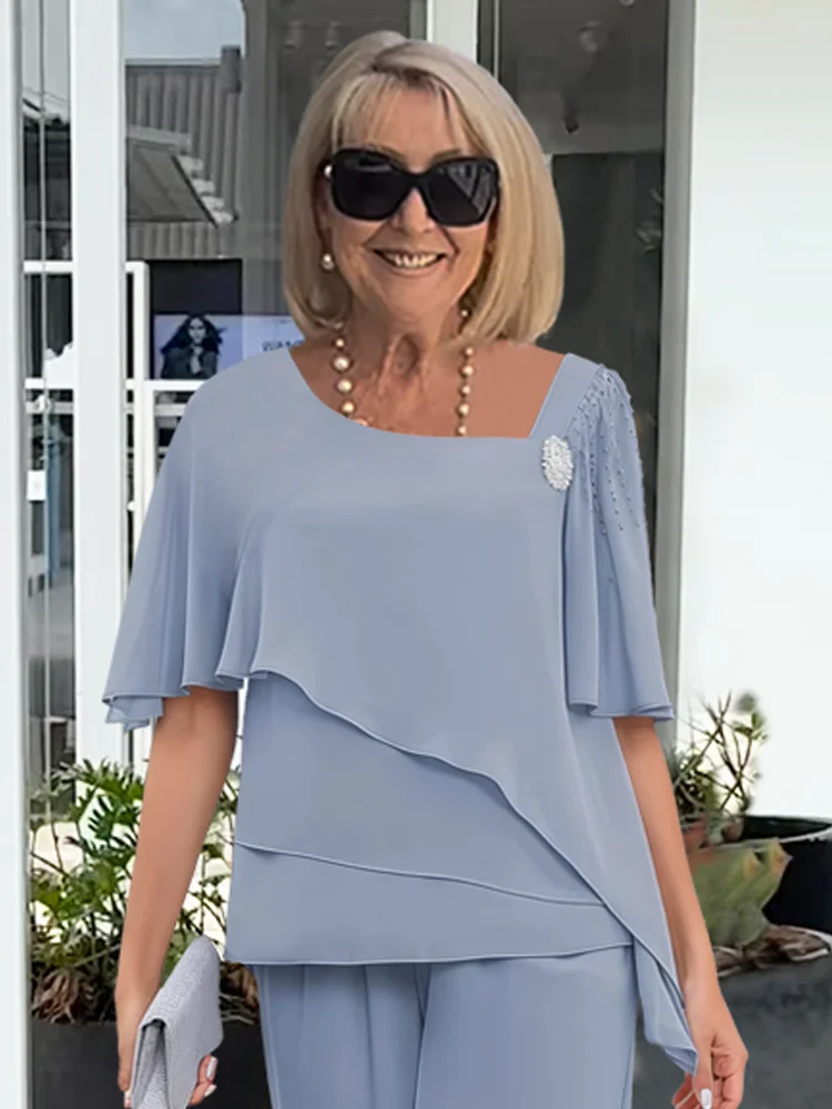 Elegant women's matching set: graceful overlay top & straight-leg pants. Perfect for sophisticated and relaxed wear.