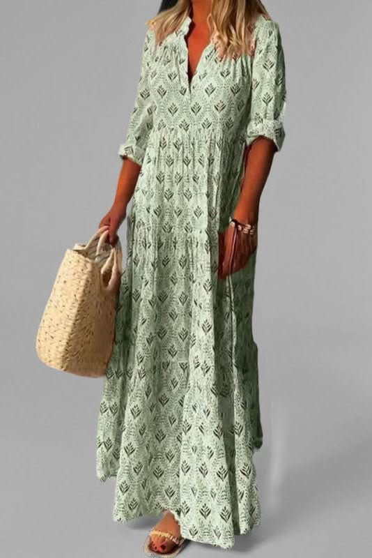Model wearing a graceful women's tiered maxi dress, a long flowy design perfect as an elegant summer occasion dress.