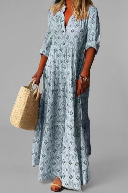 Women's flowy tiered maxi dress in motion, illustrating its graceful silhouette and elegant drape, perfect for summer.