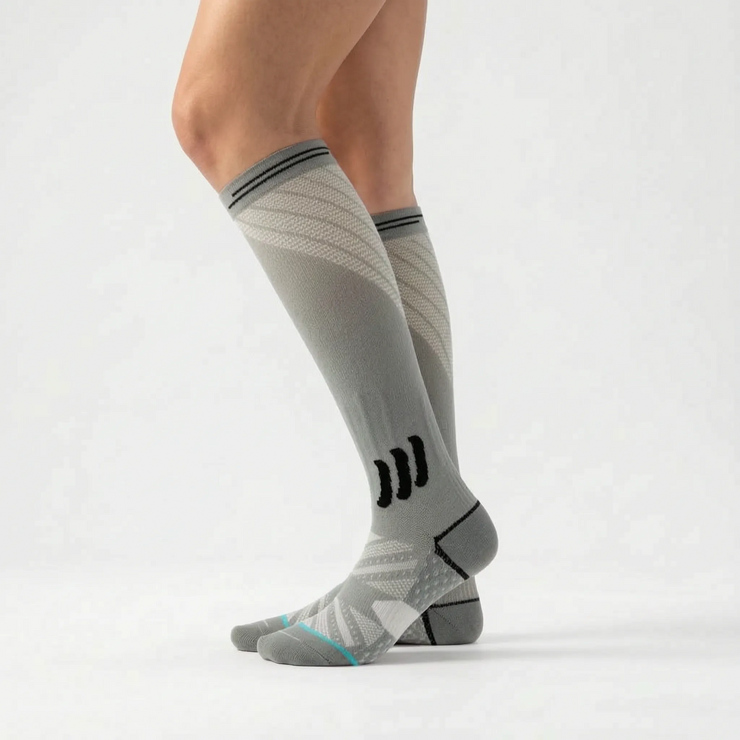 Stylish women's knee-high compression socks, providing graduated support for everyday wear, active recovery, and leg health.