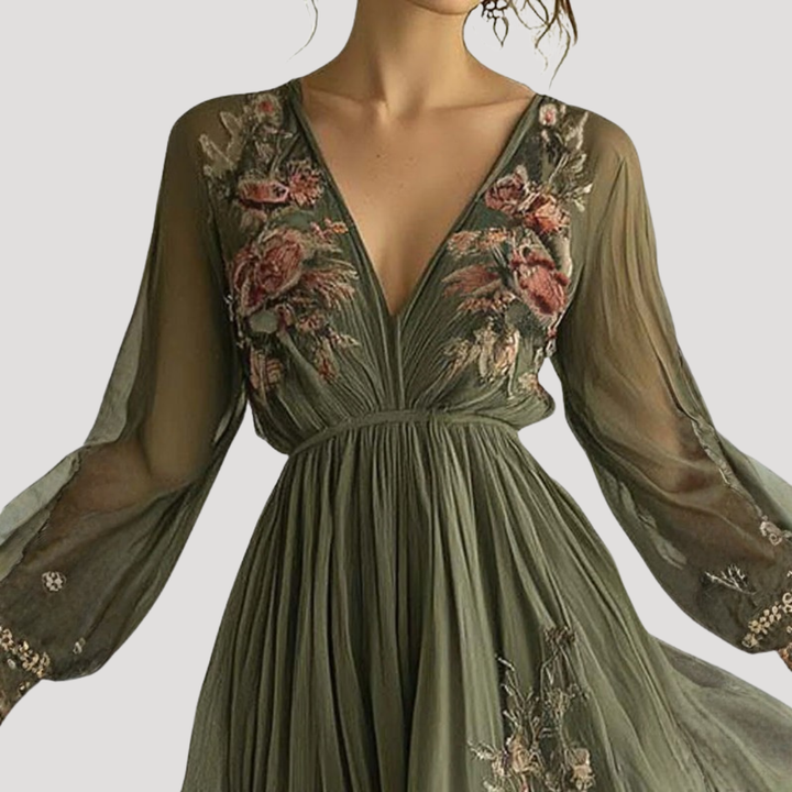 Elegant women's V-neck flowy maxi dress with intricate floral embroidery, ideal for special occasions & parties.