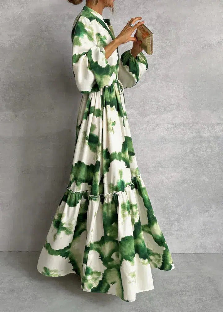 Bohemian women's tie-dye maxi dress with V-neck, long sleeves, and tiered skirt, cinched waist for spring.