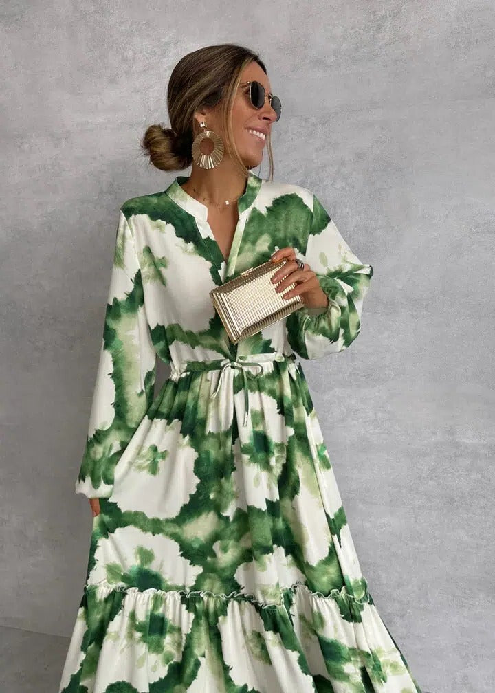 Flowy green tie-dye maxi dress for women, featuring long sleeves, a belted waist, and tiered design for comfort.