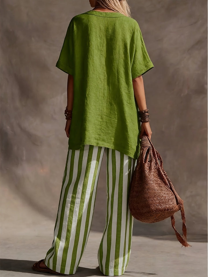 Bohemian women's green matching set featuring a V-neck top and striped wide-leg pants. Casual vacation wear.