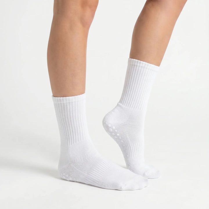 Secure your stance with women's non-slip grip crew socks. Perfect for yoga, pilates, barre, and studio fitness.