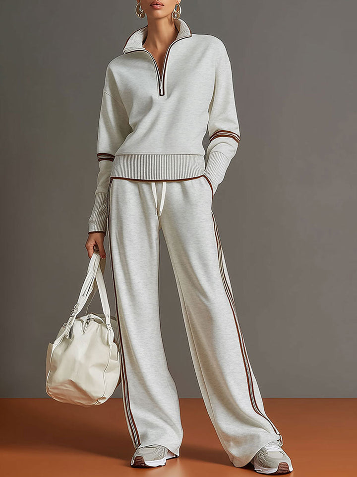 Women's half-zip sweatshirt and wide-leg pant set, a stylish matching loungewear co-ord for comfort.