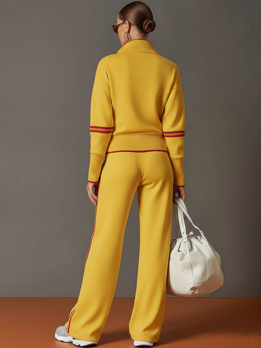 A folded women's half-zip sweatshirt & wide-leg pant matching set, ready for cozy leisurewear.
