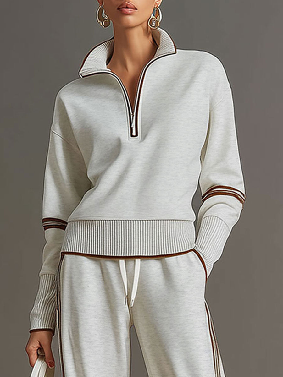 This women's half-zip sweatshirt and wide-leg pant set combines loungewear comfort with modern style.