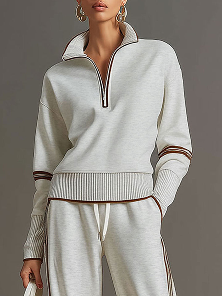 This women's half-zip sweatshirt and wide-leg pant set combines loungewear comfort with modern style.