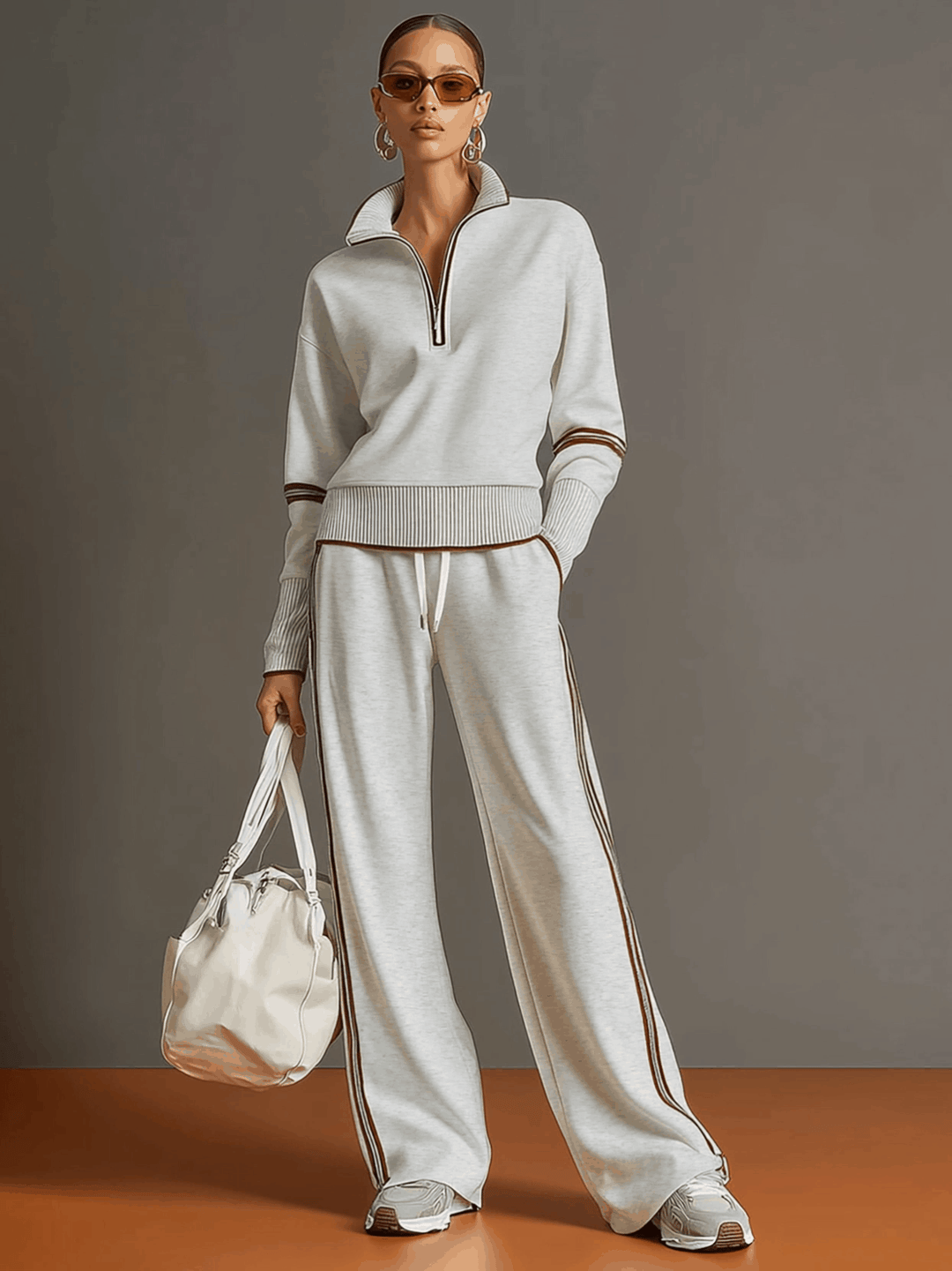 Comfortable women's two-piece outfit: half-zip sweatshirt & wide-leg pants. Perfect casual leisurewear set.