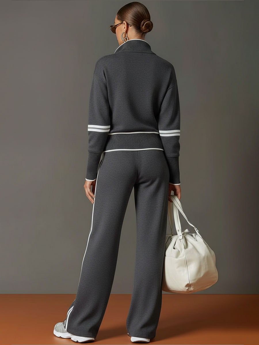 Model showcasing a women's half-zip sweatshirt & wide-leg pant set, a chic and comfy casual outfit.