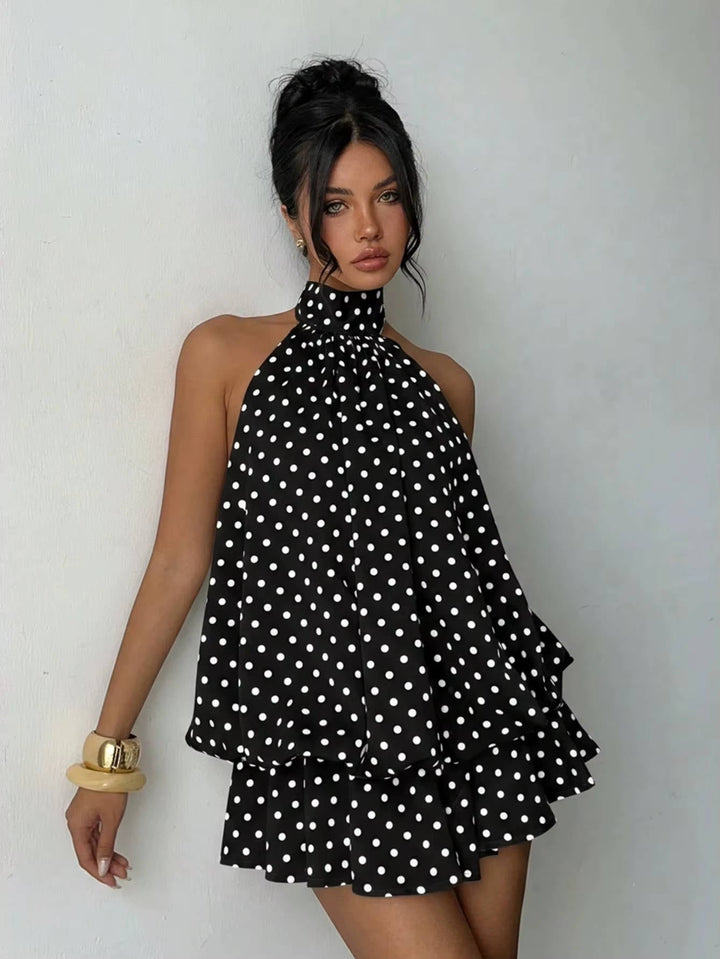 Playful ruffle hem halter mini dress for women, elegant open back, flowy silhouette, summer wear.