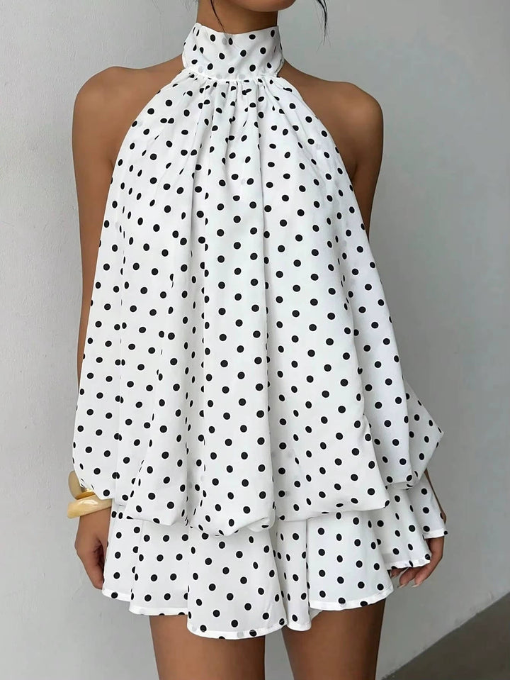 Flowy women's halter mini dress with a comfortable trapeze fit, open back & stylish ruffle hem.