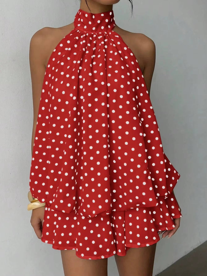 Women's event wear halter mini dress, elegant open back, ruffle hem. Perfect for special occasions.
