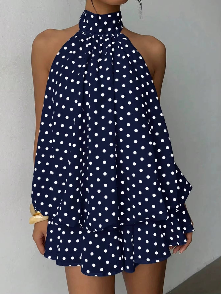 Stylish women's halter mini dress, sleeveless, elegant open back, and flirty ruffle hem for summer.