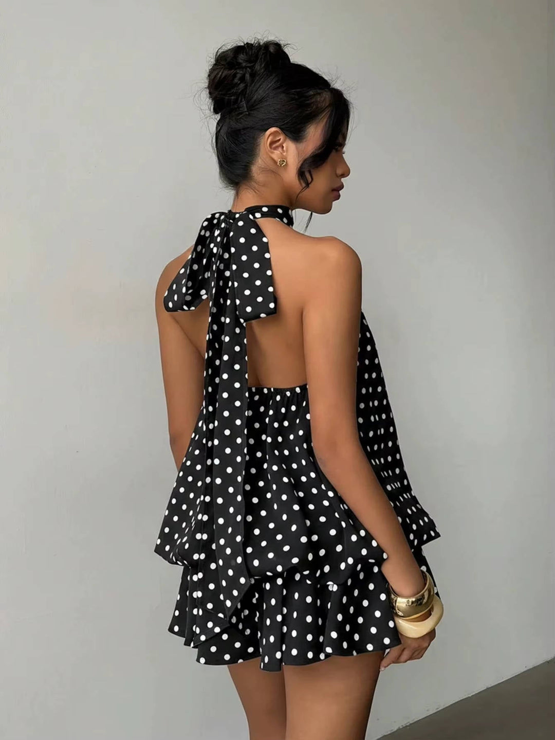 Women's halter mini dress, open back, ruffle hem. Ideal for summer parties & cocktail events.