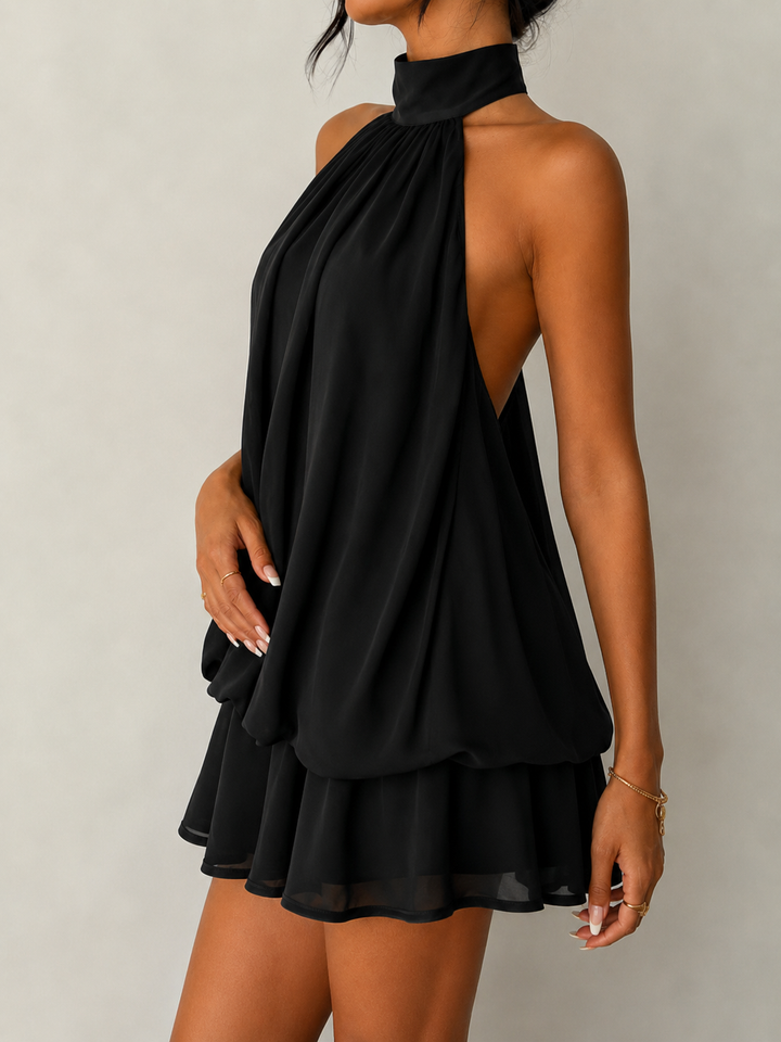 Elegant women's halter sleeveless mini dress, features a beautiful open back and a chic ruffle hem.