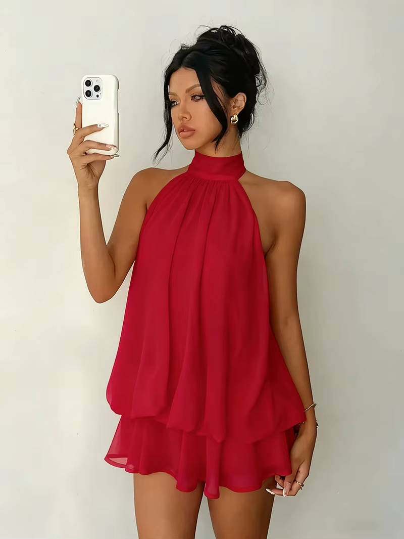 Women's halter mini dress, sleeveless, open back, and ruffle hem. Great for summer party fashion.