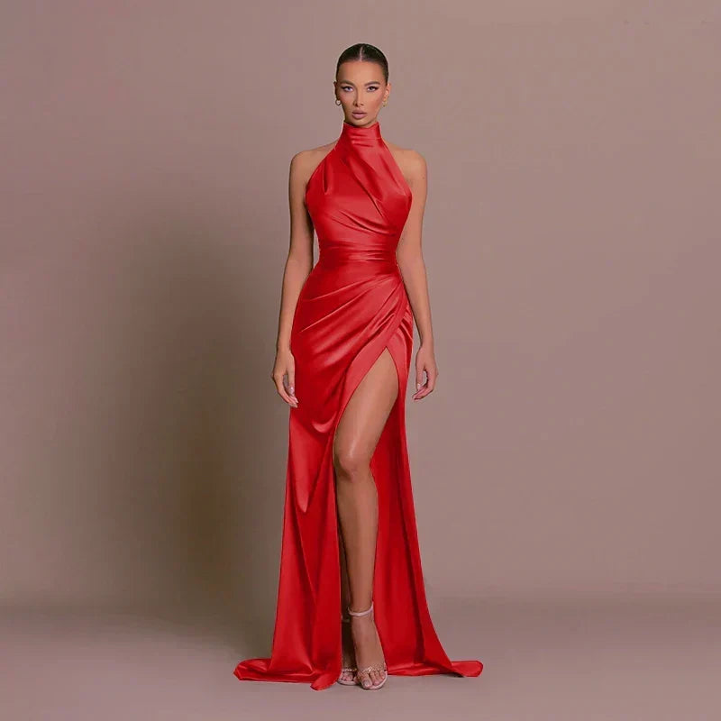 Glamorous women's red halter neck ruched maxi dress with high split. Stunning evening party gown.